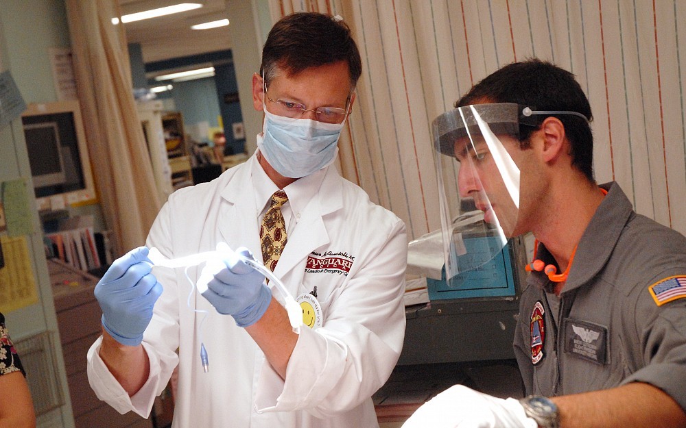 Arthur Pancioli, MD, (left) instructs resident Brent Gottesman, MD, in University Hospital's emergency department. He will serve as the principal investigator for the Cincinnati hub of a new neurological network.  