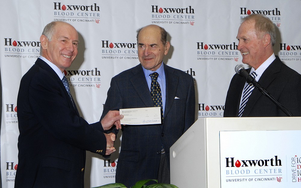 Ronald Sacher, MD, accepts a $500,000 gift on behalf of Hoxworth Blood Center from Henry Heimlich, MD, founder of the Heimlich Institute. This gift will fund research.