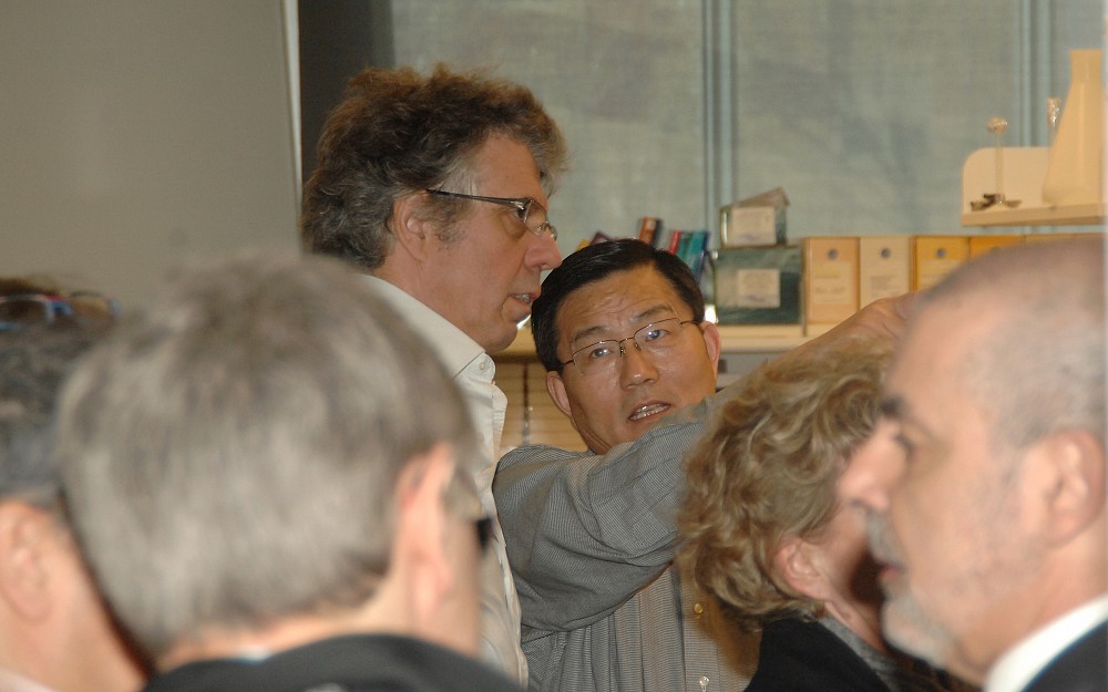 Zhongyun Dong, PhD, a UC cancer researcher, speaks to the French delegation of health officials