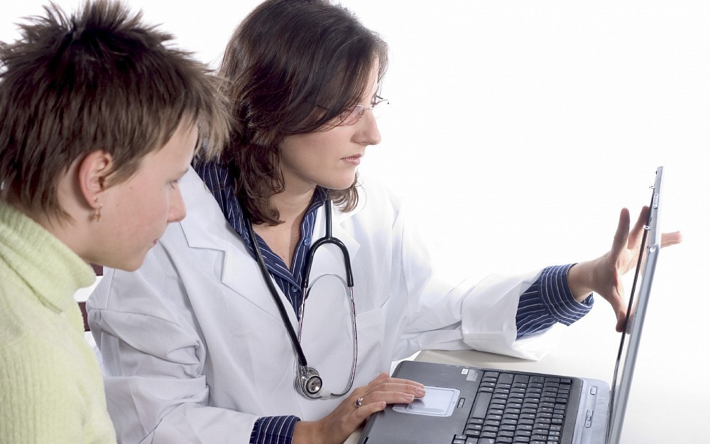 OB-GYN counseling a female patient 