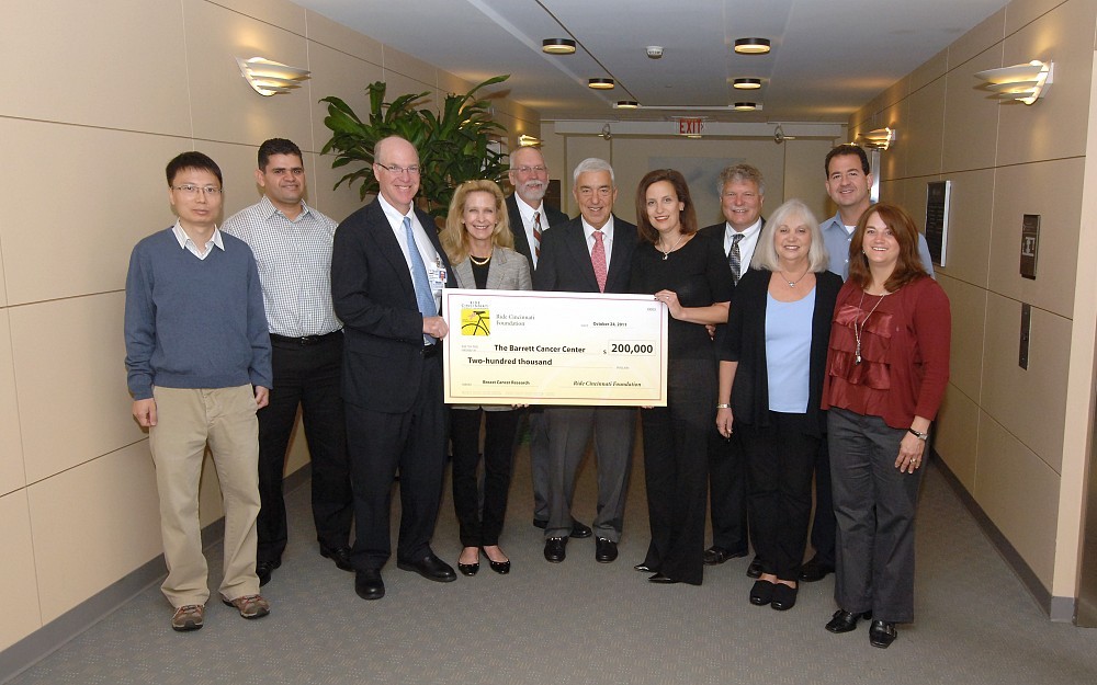 2011 Ride Cincinnati $200,000 donation check presentation. Pictured left to right: Sang-Oh Yoon, PhD, El Mustapha Bahassi,PhD, William Barrett, MD, Eileen Barrett, Nelson Horseman, PhD, Harvey Harris, DDS, Alison Gordon, Phil Logan, Cheri Logan, Michael Gordon and Kelly Weisman 