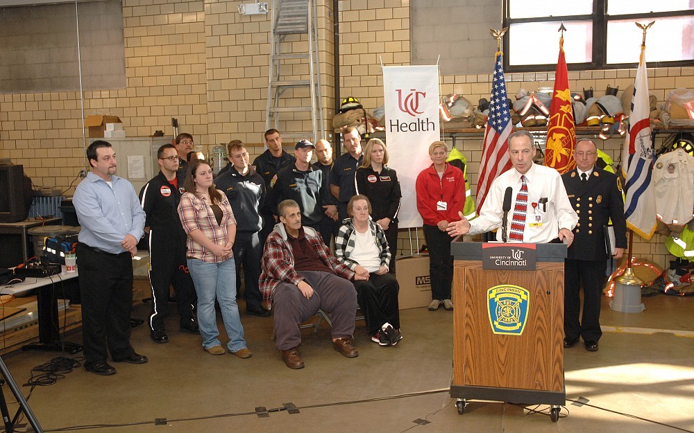 Neal Weintraub, MD, speaks at a press conference, reuniting patient Deloris Casey with her care team, including Air Care & Mobile Care and the Cincinnati Fire Department. 