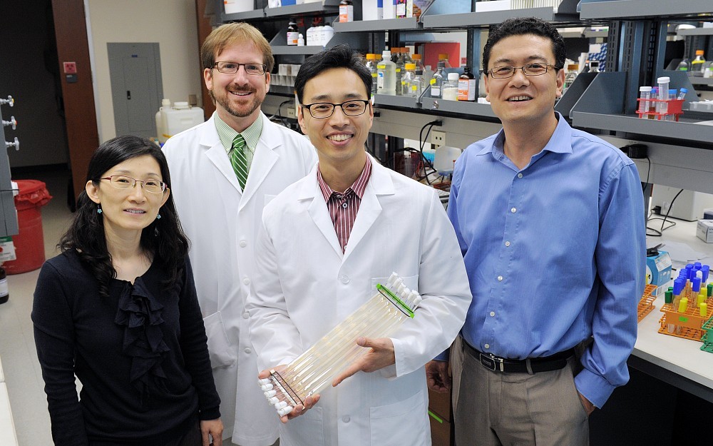 Christian Hong, PhD (foreground), with interdisciplinary team members (from left) Sookkyung Lim, PhD, Sean Moore, MD, and Seongho Song, PhD.