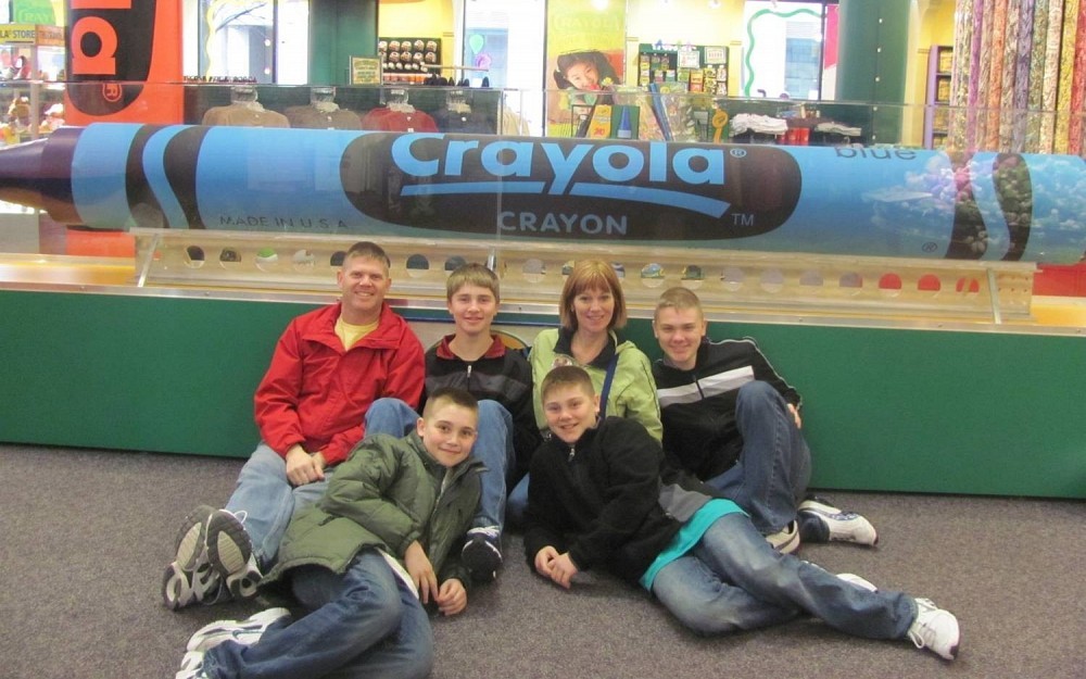Nancy Steman-Federle (center) with her four boys and husband.