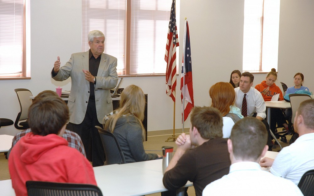 Pharmacy students attend visit by state government official to discuss health care related topics. 