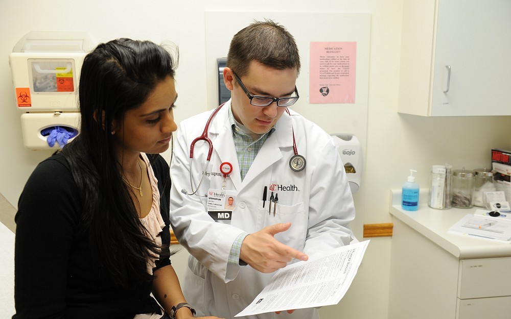 UC Health family medicine physician Jeffry Ushupun, MD, with patient