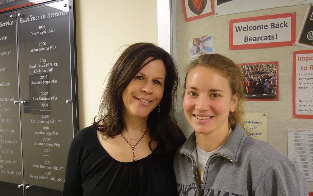 Communications sciences and disorders associate professor Carney Sotto, PhD, and student-athlete and senior Sara Knollman