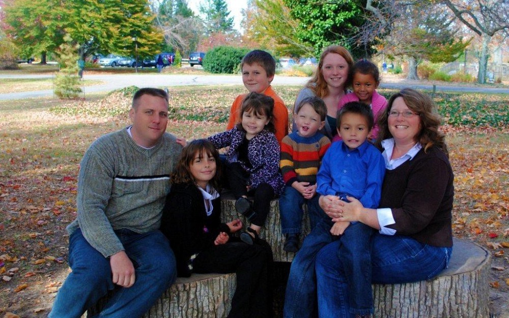 Lieutenant Colonel Mark Raaker, MSW, with wife, Chrisy, and family