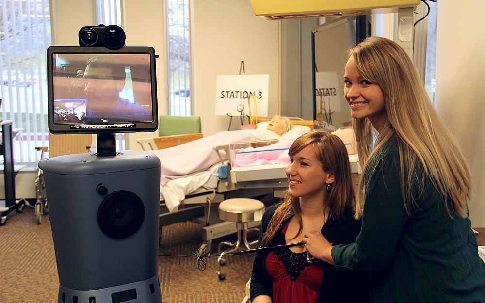 UC nursing students demonstrate how Flo-Bot can listen to a heartbeat 