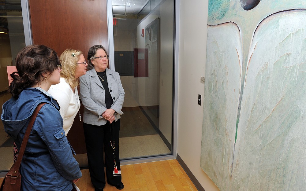 Visitors admire art at the College of Medicine.