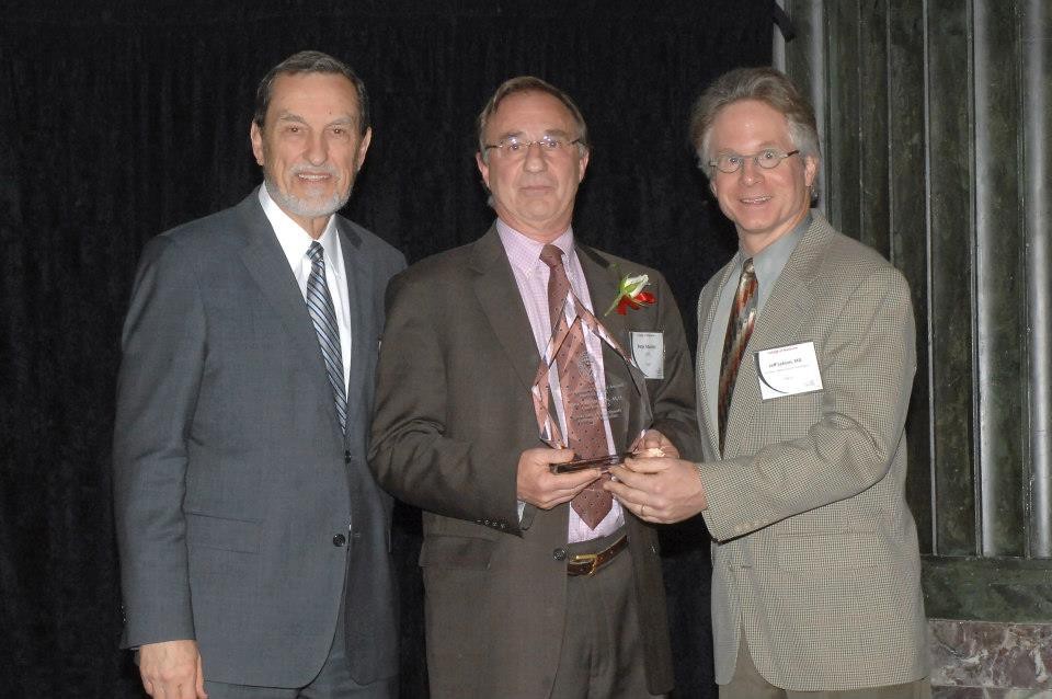 Peter Mueller, MD, receives the 2013 Distinguished Alumni Award at the Alumni Reunion.