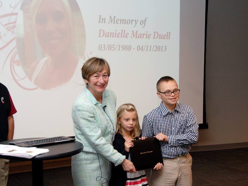 Nursing Dean Greer Glazer, PhD, presented DuellÂ s two young children, Ella and Sabin, with DanielleÂ s diploma. 