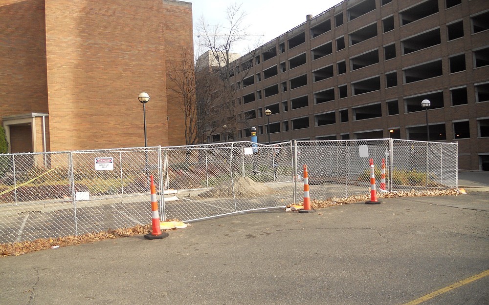 Preparations are underway near Eden Garage for an electric car charging station.