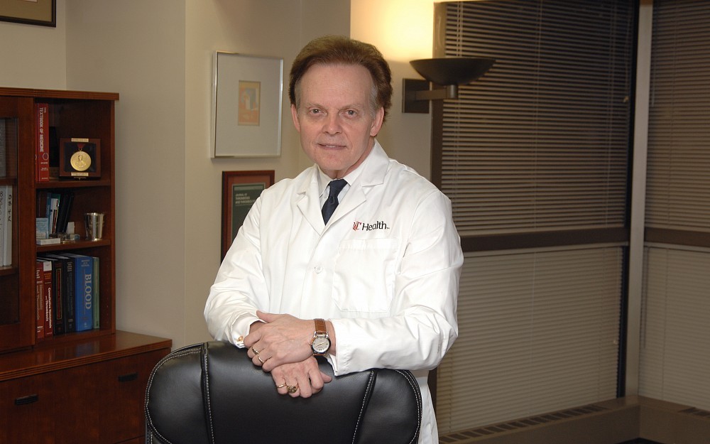 Richard Becker, MD, director and physician-in-chief of the UC Heart, Lung and Vascular Institute shown in his office.