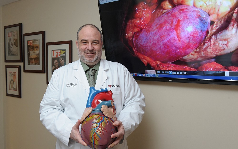 Arie Blitz, MD, discusses surgical procedures in his office in the Medical Sciences Building.
