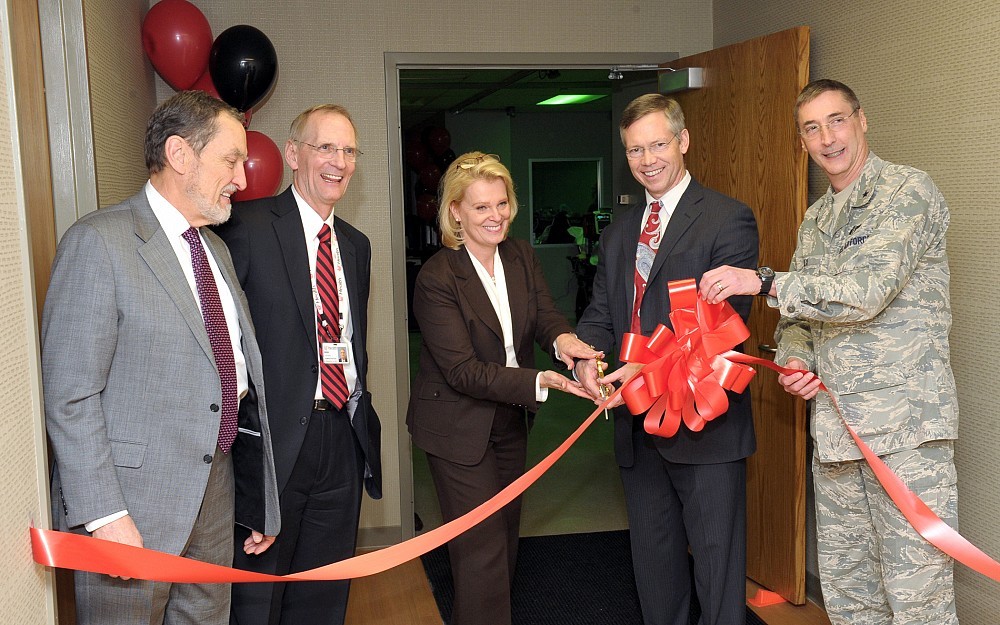 Cutting the ribbon of the UC Health Simulation Center (from left to right) : UC College of Medicine Dean Thomas Boat, MD; UC Health President and CEO Richard Lofgren, MD; UC Medical Center President and CEO Lee Ann Liska; Department of Emergency Medicine Chair Arthur Pancioli, MD, and Brigadier General Timothy T. Jex, Commander, 711th Human Performance Wing.