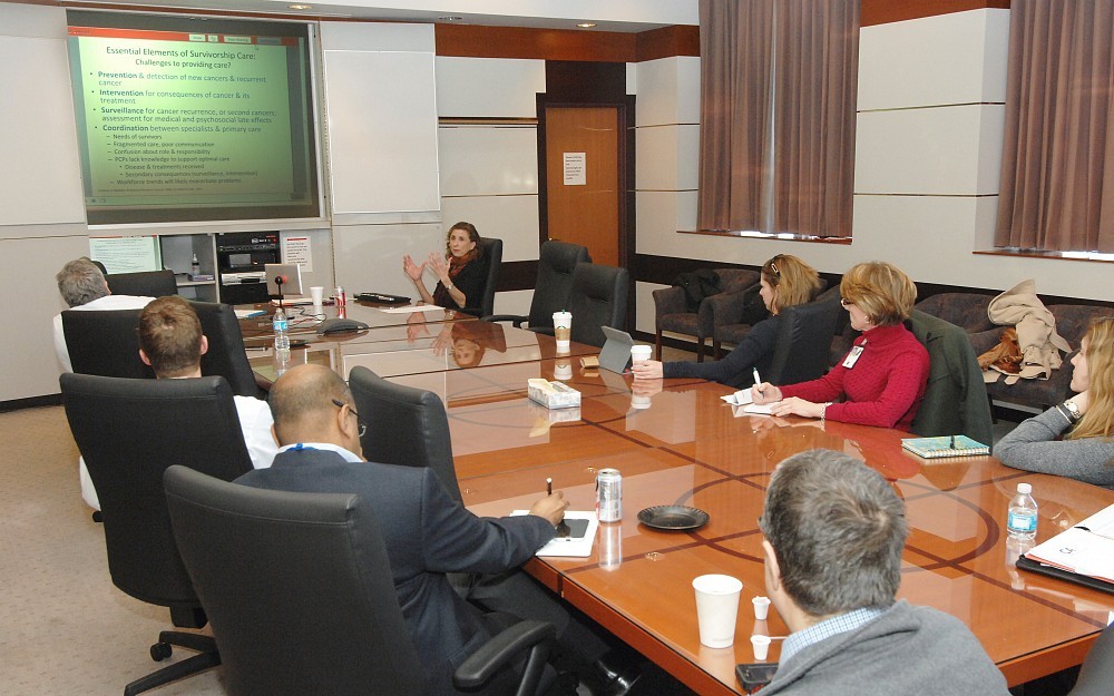 Linda Jacobs, PhD, speaks to a room of health care professions during her consultation visit.