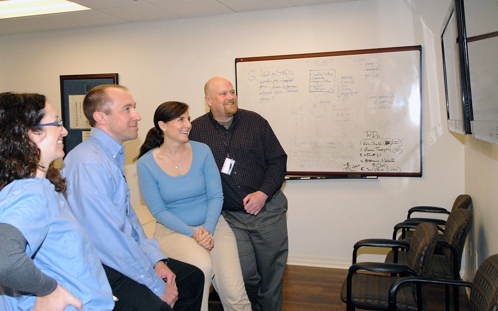 Members of the Emergency Medicine residency program watch their matches come in on Thursday, March 20.