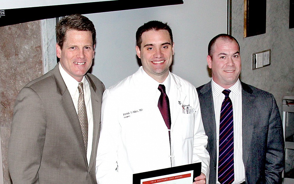 Patrick Solan, MD (center), was among five residents honored in connection with National Doctors' Day 2014. With him are Bradley Davis, MD (left), and John Deledda, MD.