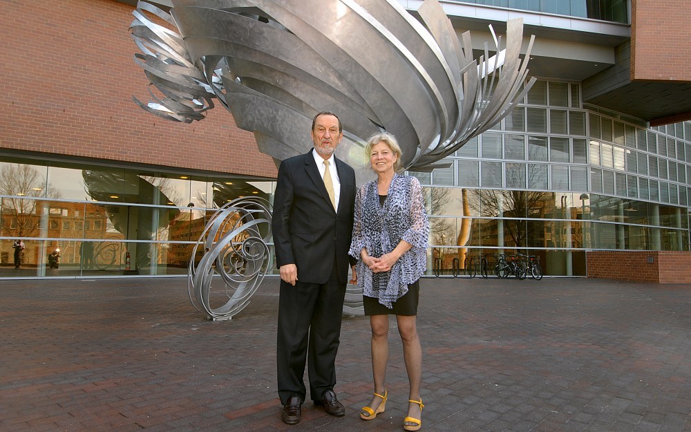 College of Medicine Dean Thomas Boat, MD, and sculptor Alice Aycock with Aycock's "Super Twister."