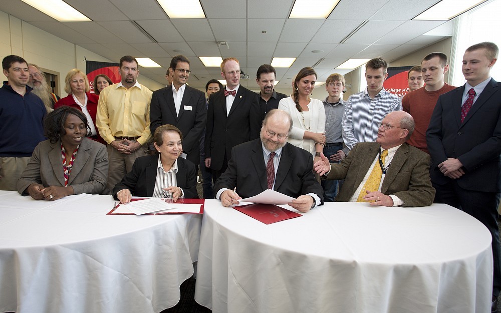 The signing ceremony for the "IT + MSHIÂ  degree took place Wednesday, April 30,  and featured CECH Dean Larry Johnson, PhD, and College of Allied Health Sciences (CAHS) Dean Elizabeth King, PhD, as well as guest speaker, John Hutton, MD, professor of pediatrics and associate dean for information services at the College of Medicine.