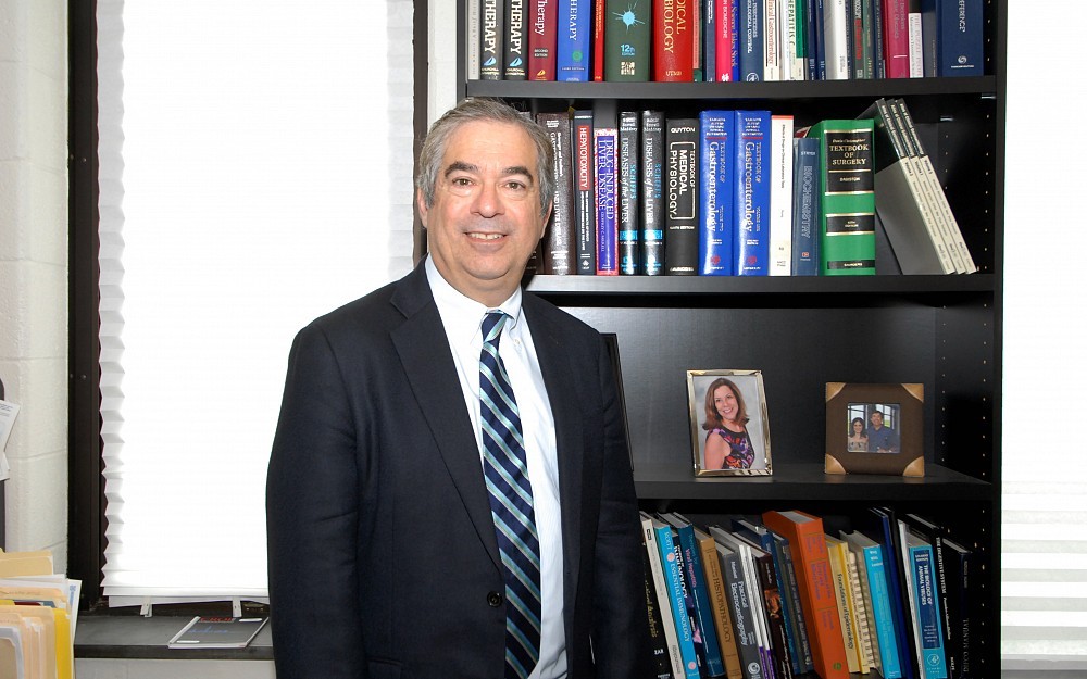 Kenneth Sherman, MD, PhD, is a professor of digestive diseases at UC.