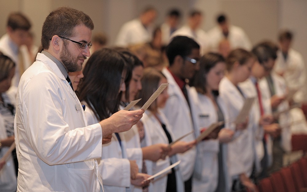 To conclude the 2014 Student Clinician Ceremony, rising third year students recited their oath of professionalism.