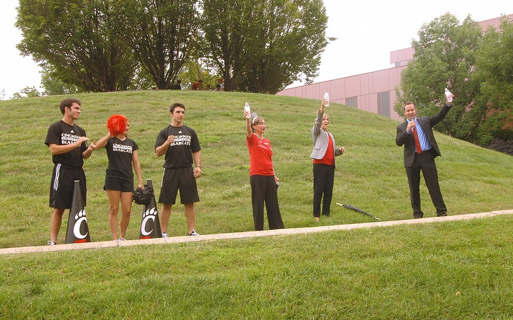Members of the UC Bearcat cheerleading squad with James L. Winkle College of Pharmacy Dean Neil MacKinnon, PhD (right), College of Allied Health Sciences Interim Dean Tina Whalen, EdD, DPT, (second from right), and College of Nursing Dean Greer Glazer, PhD (third from right). 