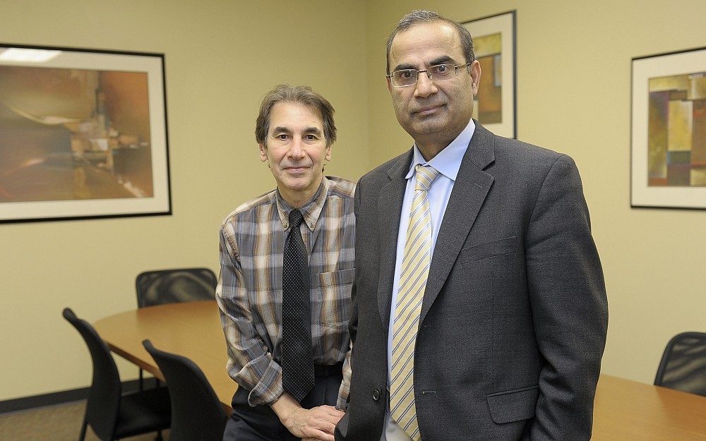 Robert Krikorian, PhD (left), and Muhammad Aslam, MD, are studying a new investigational drug for people with mild to moderate Alzheimer's disease.