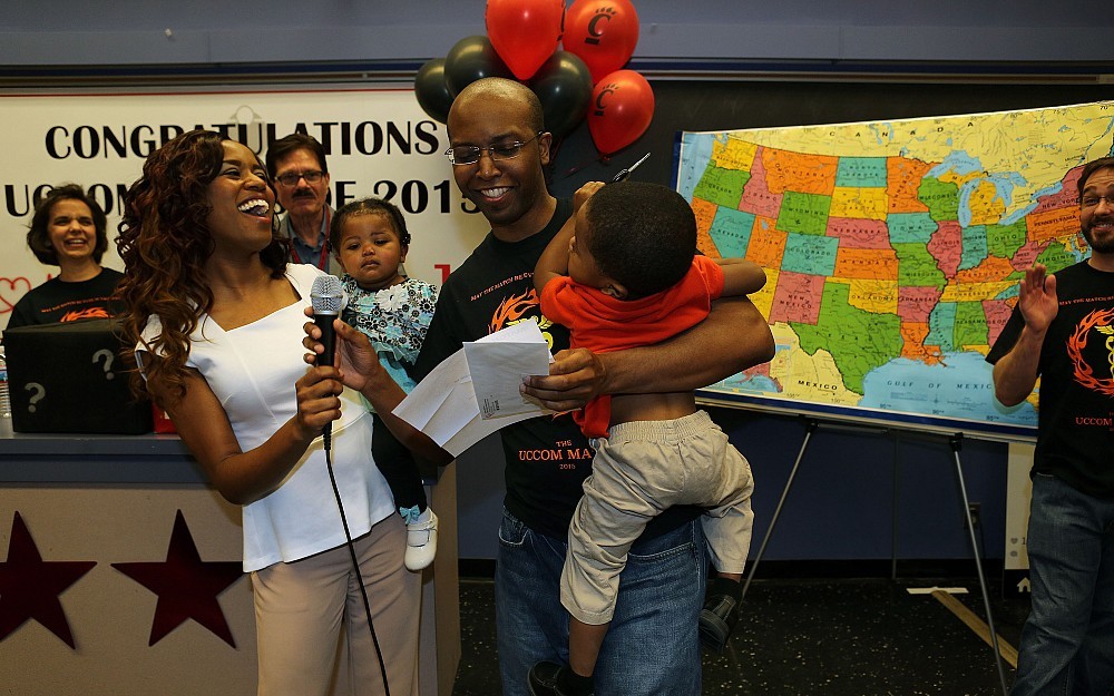 Fourth-year medical student Norris Hollie celebrates his match with family at UC College of Medicine's 2015 Match Day celebration.
