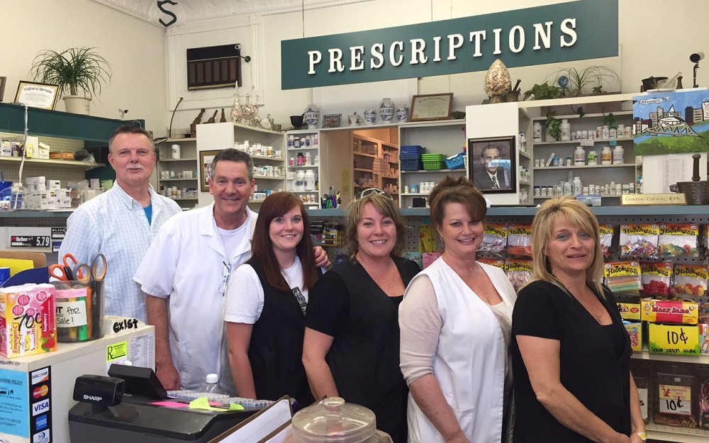 Rick Schaeper (85') , 2nd on left, with his family pharmacy staff.  