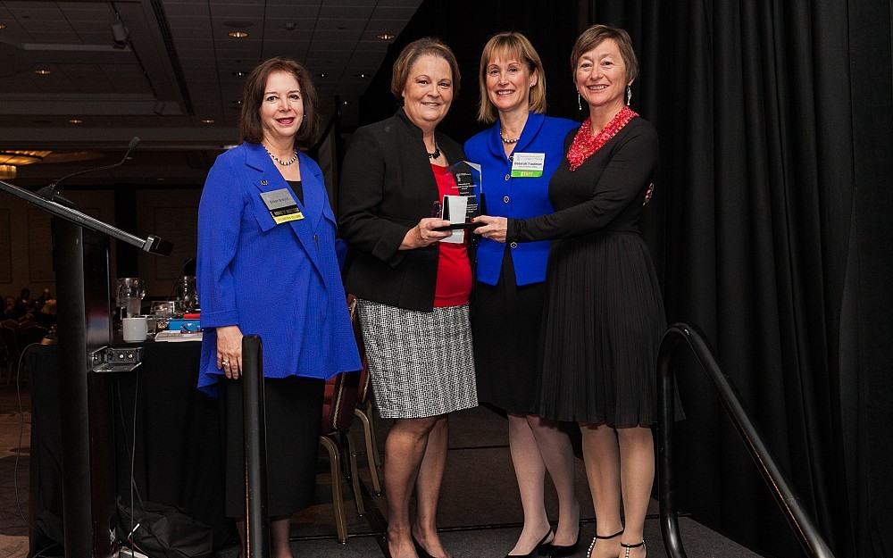 iCoN, a UC College of Nursing program, has received national recognition for innovation in education from the American Association of Colleges of Nursing. Pictured above from left to right: AACN Board Chair Eileen Breslin; Yvette Pryse, PhD, executive director of undergraduate programs and a faculty member within the UC College of Nursing; AACN President and CEO Deborah Trautman; and UC College of Nursing Dean Greer Glazer, PhD. 