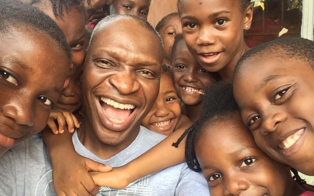 Dr. Cheedy Jaja of the UC College of Nursing with some of the orphans at the Dream Home in Sierra Leone.