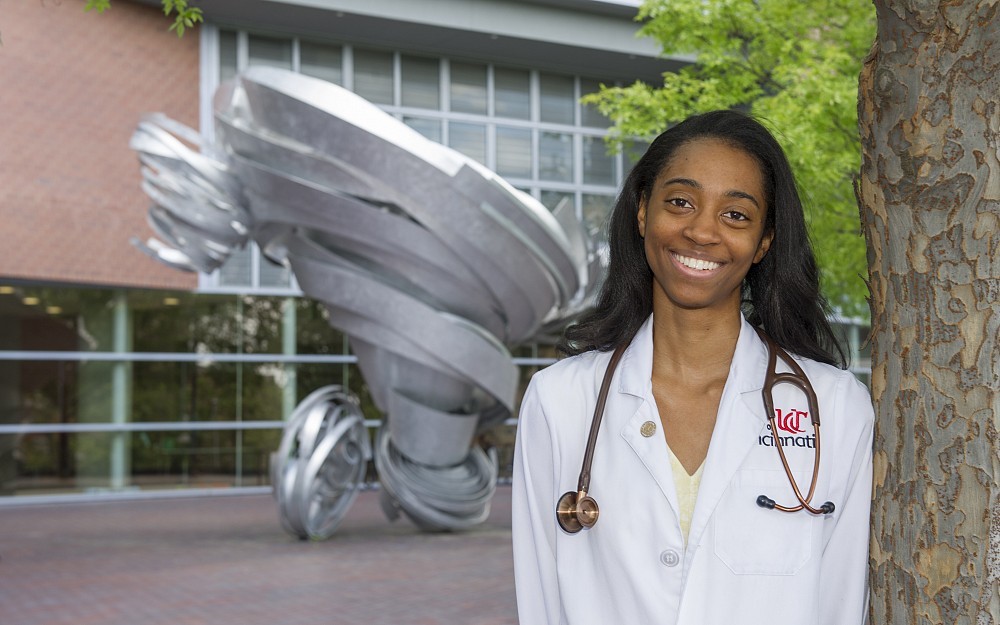 Codie-Anne Crew shown in front of Care Crawley Building plans to practice family medicine. She is one of 169 members of the Class of 2016, who will receive medical degrees as part of Honors Day.