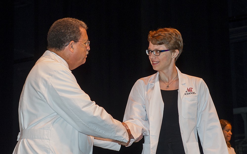 COM Dean William Ball welcomes Anastassia Tselikova during the 2016 White Coat Ceremony.