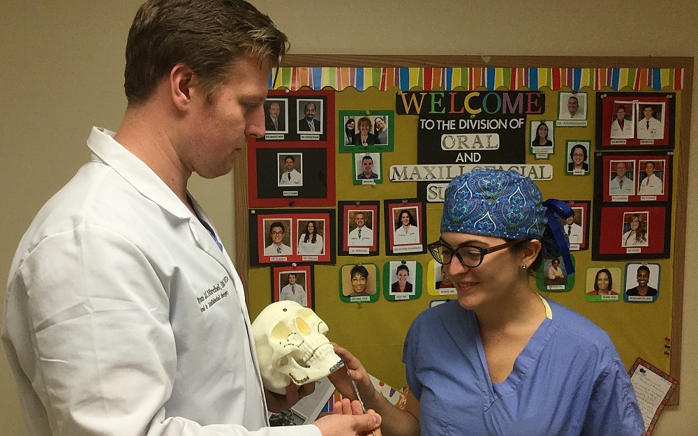 Ryan Mirchel, MD with Irelsy Rivera Velazquez, DMD, resident