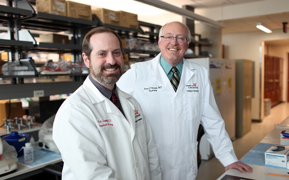 James Herman, PhD (right), directs the UC Neurobiology Research Center at the UC Neuroscience Institute. At left is collaborator Kim Seroogy, PhD.