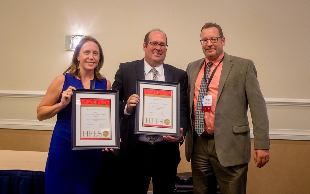 Susan Kotowski, PhD, assistant professor in the College of Allied Health Sciences, and Kermit Davis, PhD, associate professor in the Department of Environmental Health with Peter Johnson the chair of the HFES Awards Committee, presenting their awards at the HFES International Annual Meeting, Sept. 23, 2016