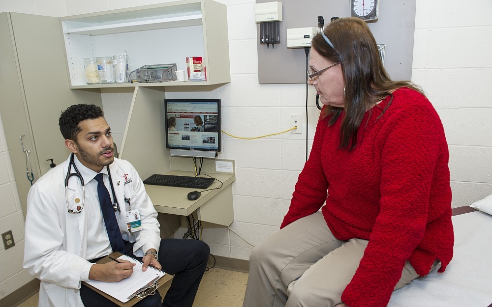 Daniel Bowles, a second-year medical student, speaks with Roberta Grosser, a Cincinnati area transgender activist, in the UC College of Medicine Simulation Center.