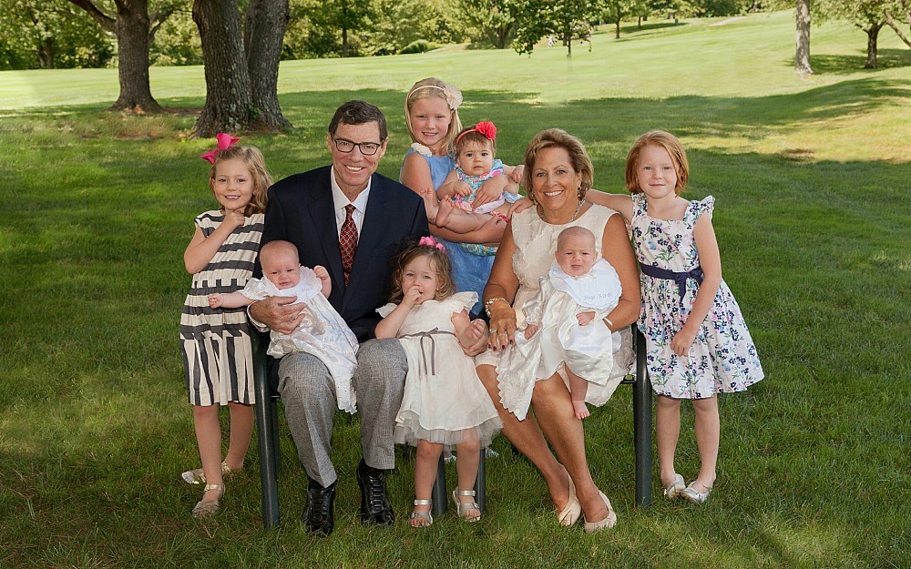 Doug Lange with his wife and seven grandchildren.
