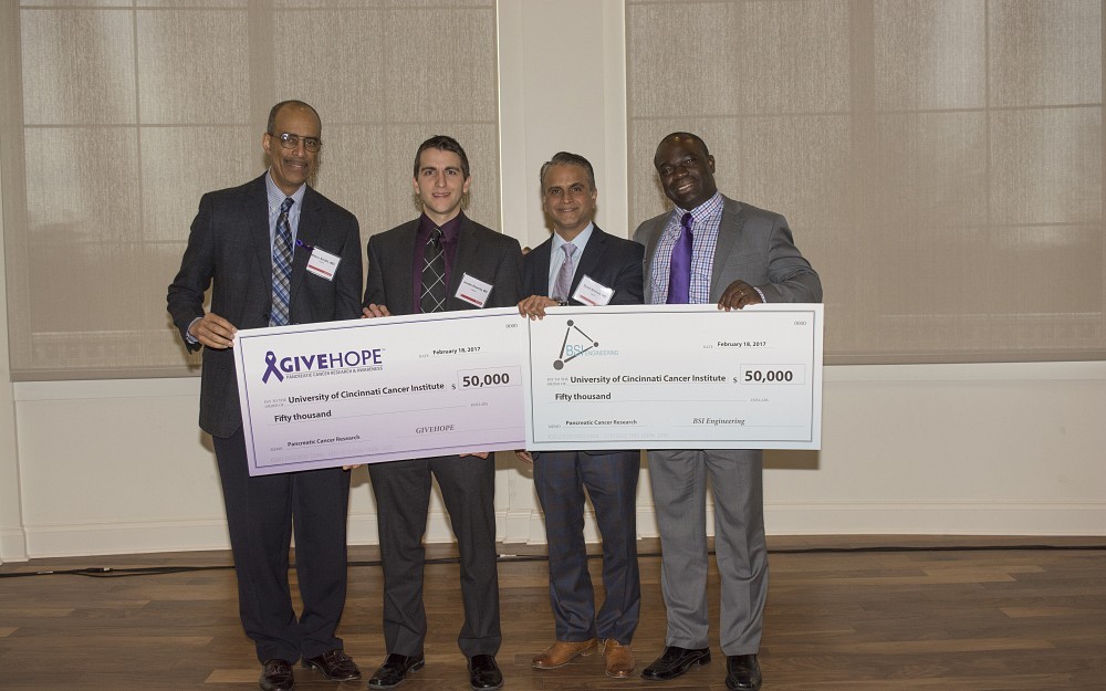 GIVEHOPE and BSI Engineering presented checks to leaders within the UC Cancer Institute's Pancreatic Disease Center during a patient symposium Feb. 18. The money will fund pancreatic cancer research at UC. From left to right: Milton Smith, MD; Jordan Kharofa, MD; Syed Ahmad, MD; Olugbenga Olowokure, MD.