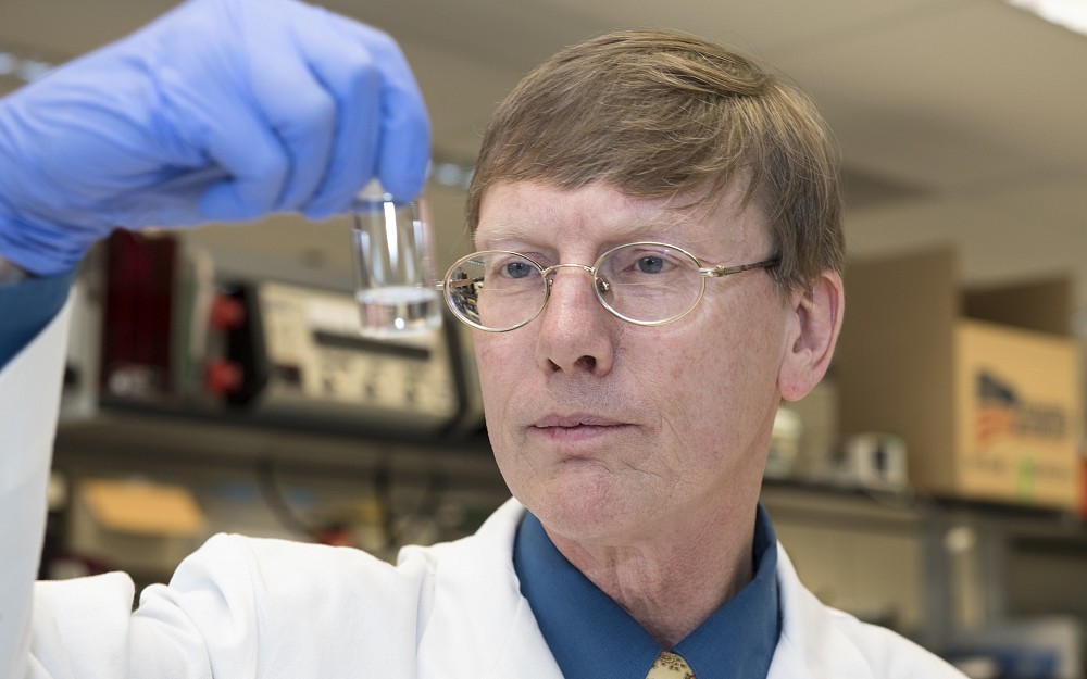 Andrew Norman, PhD, shown in his laboratory in the College of Medicine.