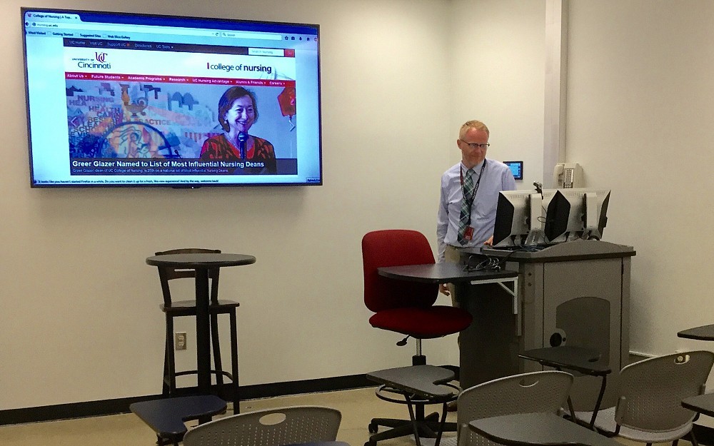 Matt Rota, director of the Office of Technology-Enhanced Learning in the College of Nursing in a classroom with a technology upgrade