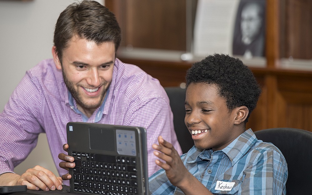 UC med student Paul Warren shown with his mentee, Keshawn Jefferson.