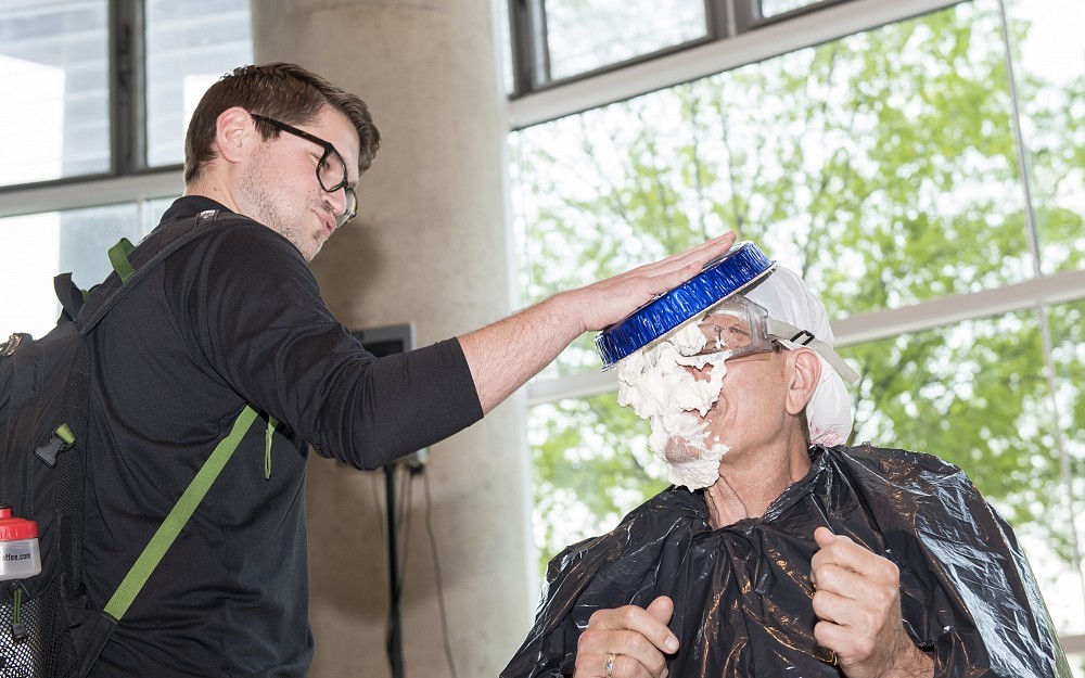 Bruce Giffin, PhD, took a pie from med student Nick Yeatts for a good cause.
