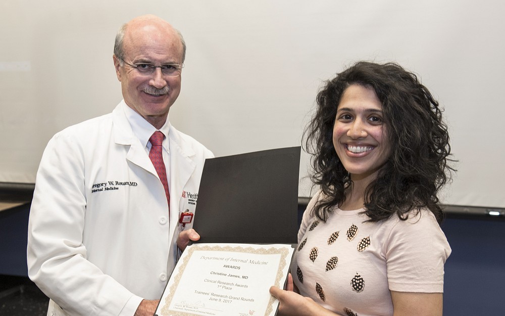 Gregory Rouan, MD, is shown with Christine James, MD, who won first place in the clinical research category for TraineesÂ  Research Grand Rounds Poster Session as part of the 6th Annual Department of Internal Medicine Research Symposium.