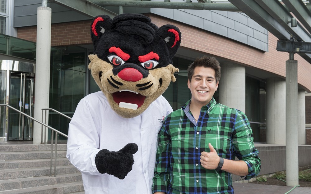 First-year medical student Pablo Alarcon is shown on the steps of CARE/Crawley Building during Orientation Week 2017 in the College of Medicine.