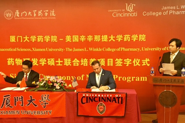 Photo caption: Dean Neil MacKinnon, PhD, of the Winkler College of Pharmacy and Dean Xiaokun Zhang of XiamenÂ s School of Pharmaceutical Sciences sign an official agreement to create the MS in Pharmaceutical Sciences with specialization in drug development program.