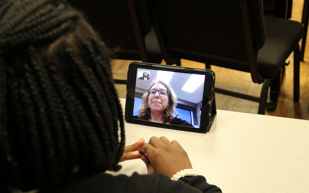 Carolyn Smith, PhD, with the College of Nursing uses FaceTime to provide counseling to a teenager as part of her research