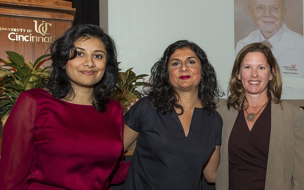 Left to right, Sejal Sanghvi, Esq., Rupal Sanghvi, MPH, Sian Cotton, PhD. Photo of Vijay Sanghvi, MD, on video screen.